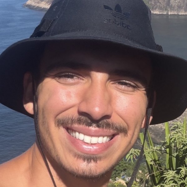 Caio Costa on a hilltop overlooking the ocean in Rio de Janeiro